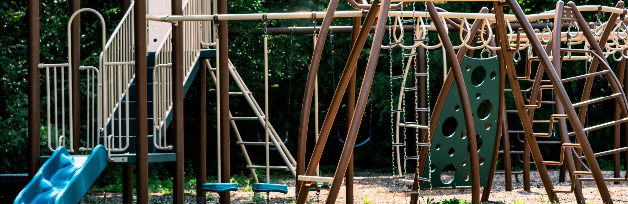 Close up image of a brown playground in a park