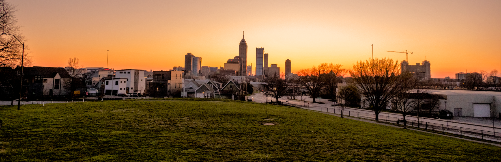 Park that overlooks the downtown Indianapolis skyline at sunset
