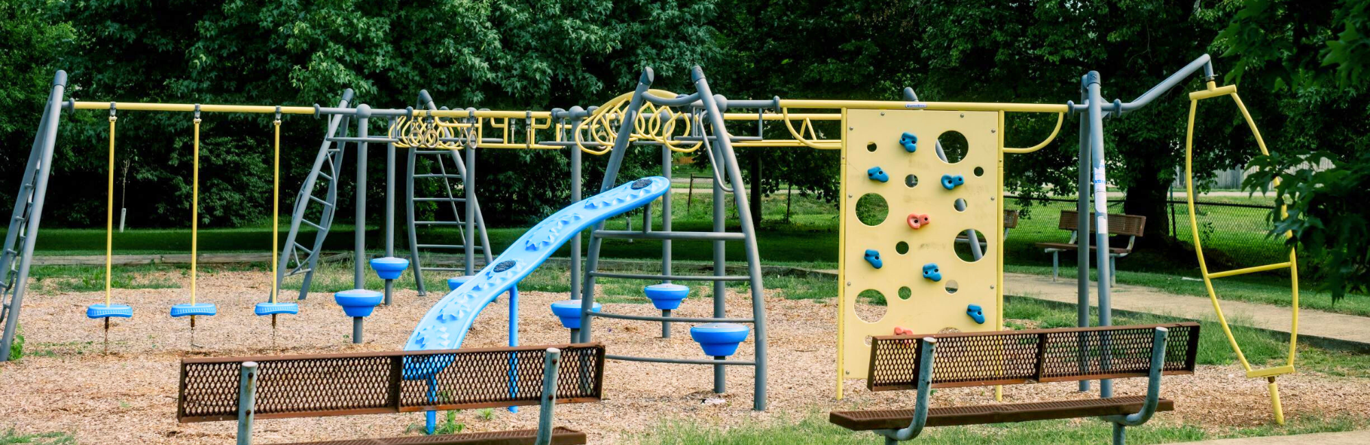 Park with a playground and benches