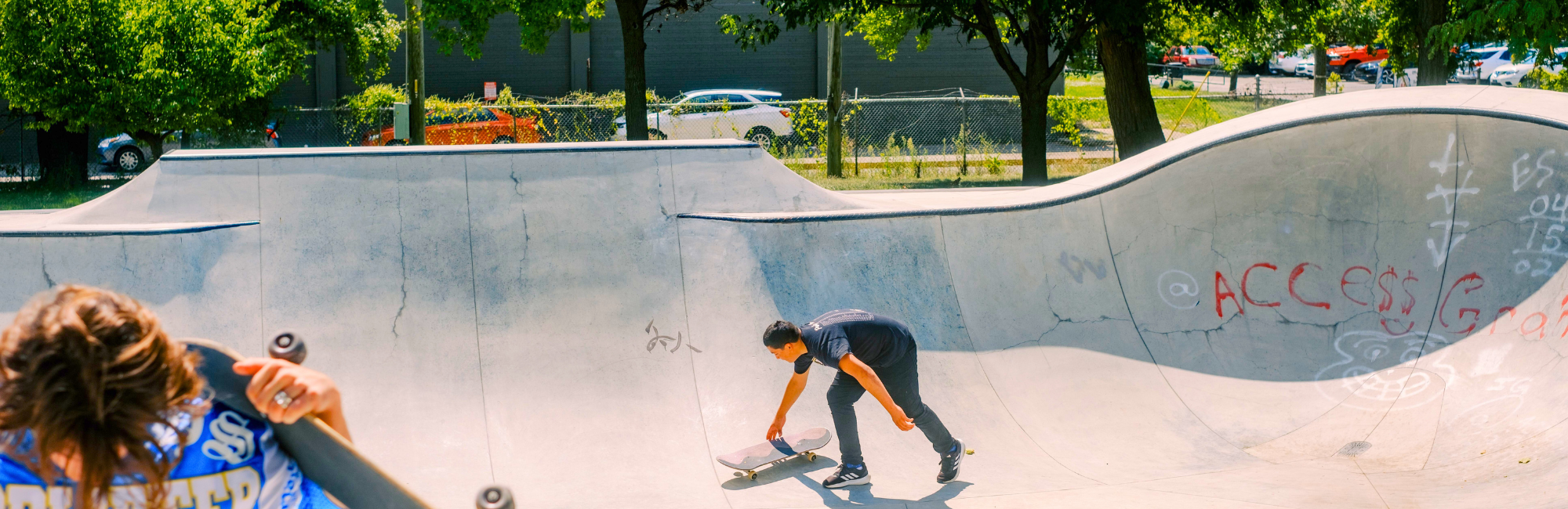 People skateboarding in the Willard Park Flow Bowl