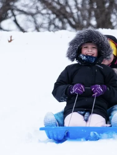 Child sledding at Rhodius Park