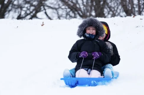 Child sledding at Rhodius Park