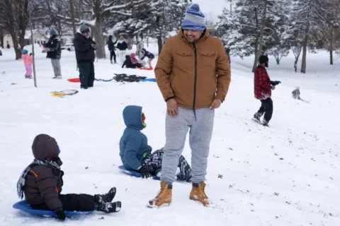 Family sledding at Rhodius Park