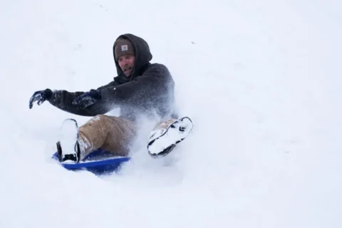 Person sledding at Rhodius Park